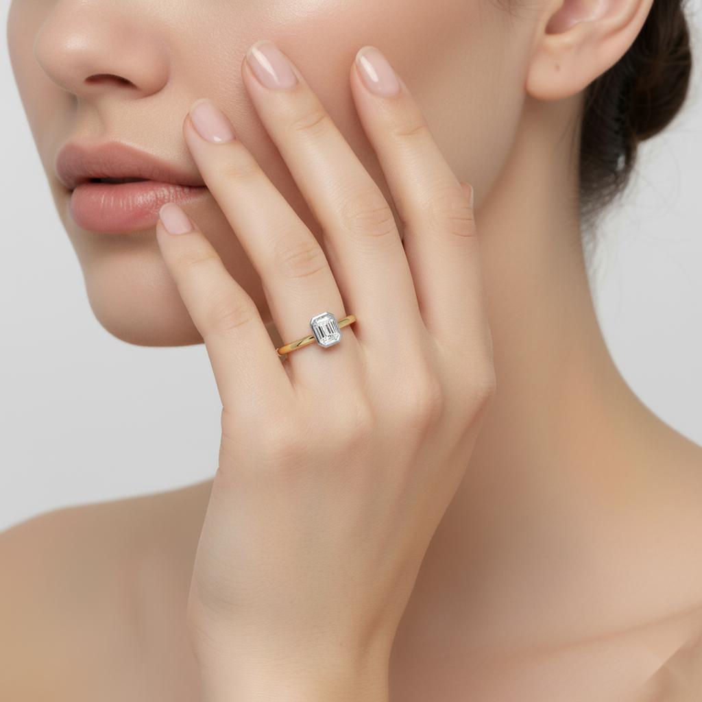 Emerald Solitaire With Bezel Set Engagement Ring