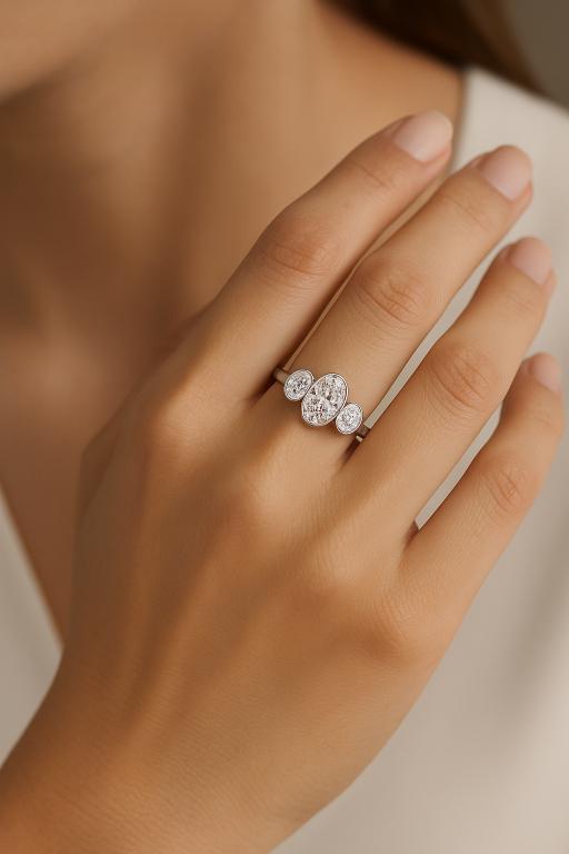 Oval Three Stone Bezel Set Engagement Ring