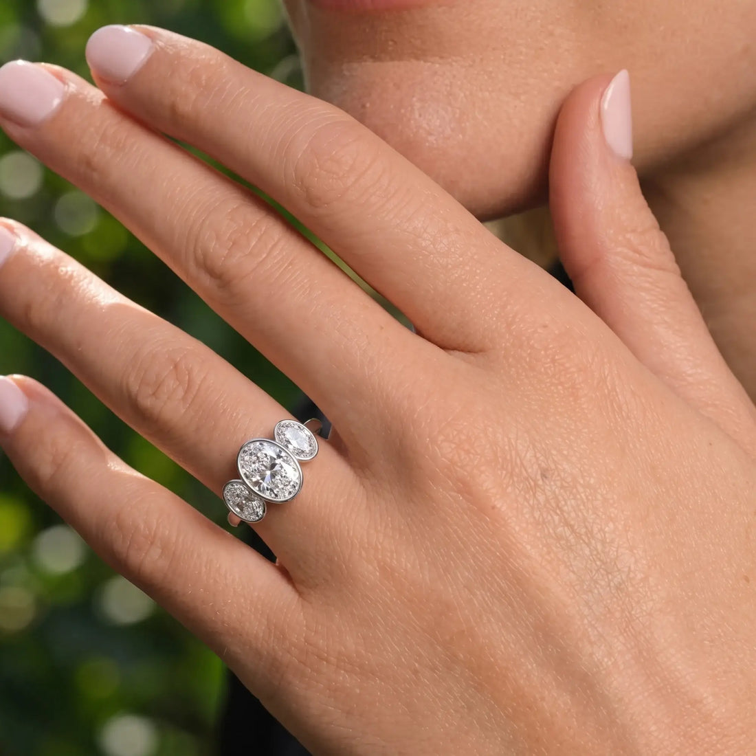 Oval Three Stone Bezel Set Engagement Ring