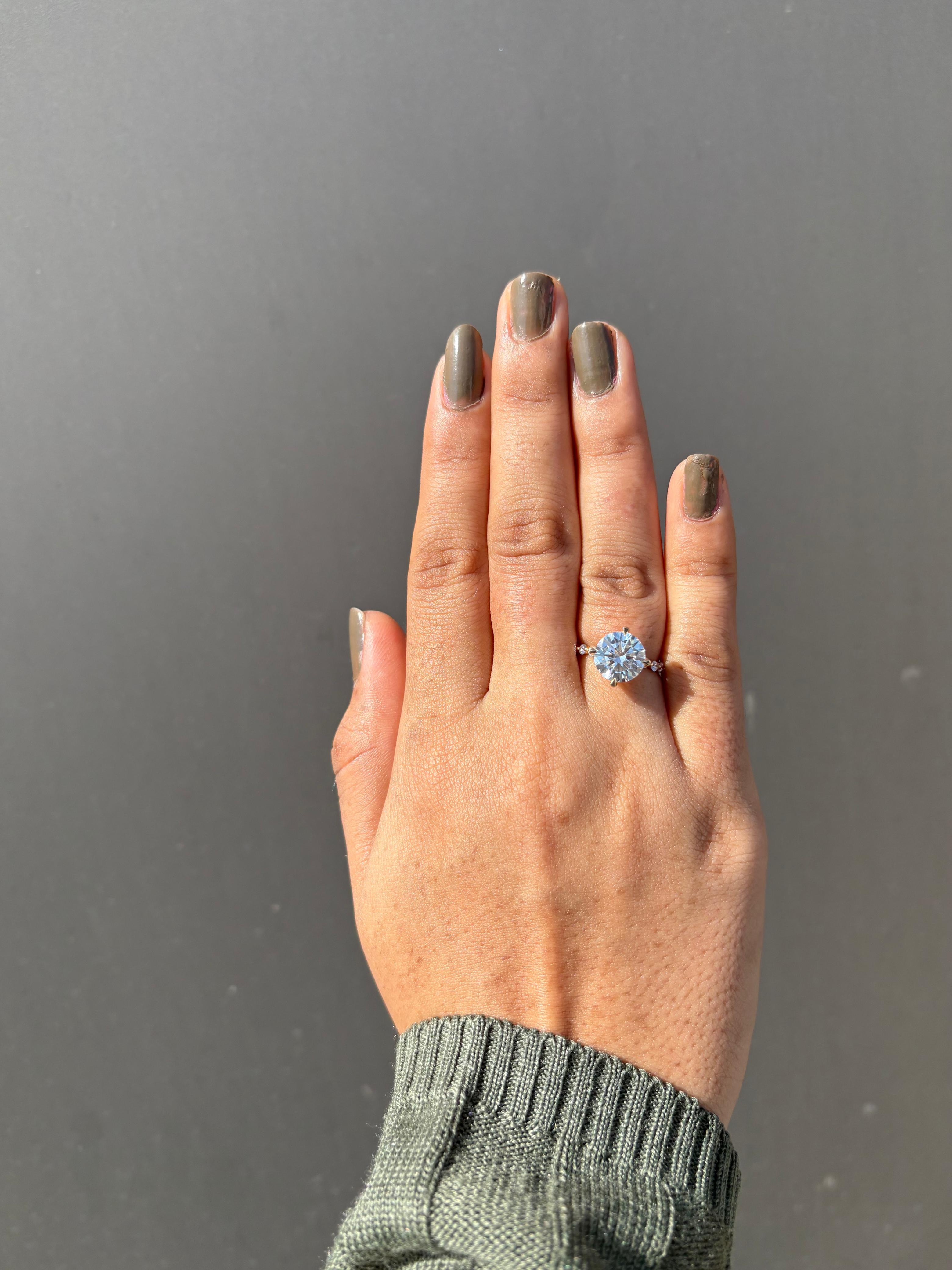 Round Hidden Halo with Shared Prong Engagement Ring