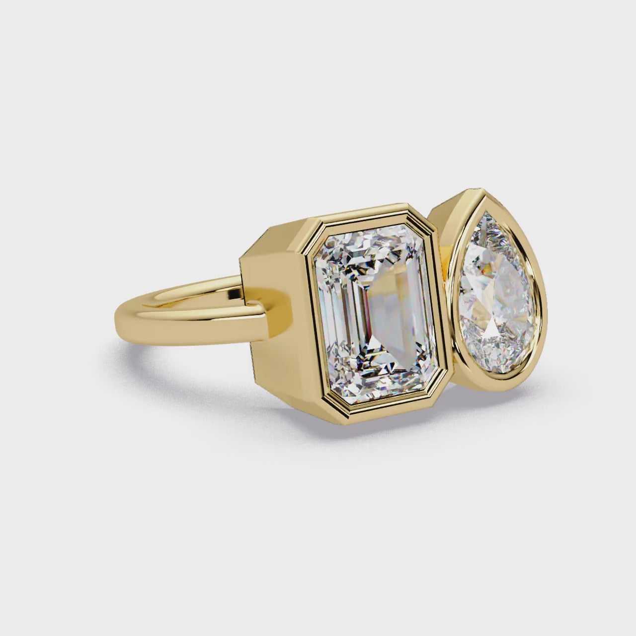 Pear & Emerald Bezel Toi Et Moi Engagement ring