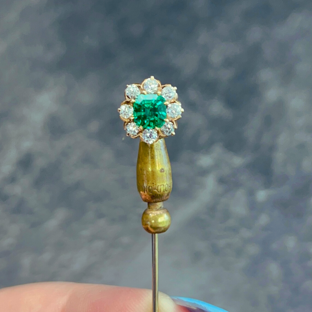 Before – an emerald stick pin
